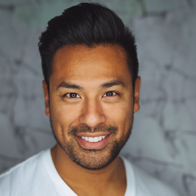 man wearing white V-neck shirt